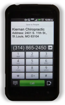 Smartphone displaying Kiernan Chiropractic contact information with address and phone number (314) 865-2450 on phone dial pad